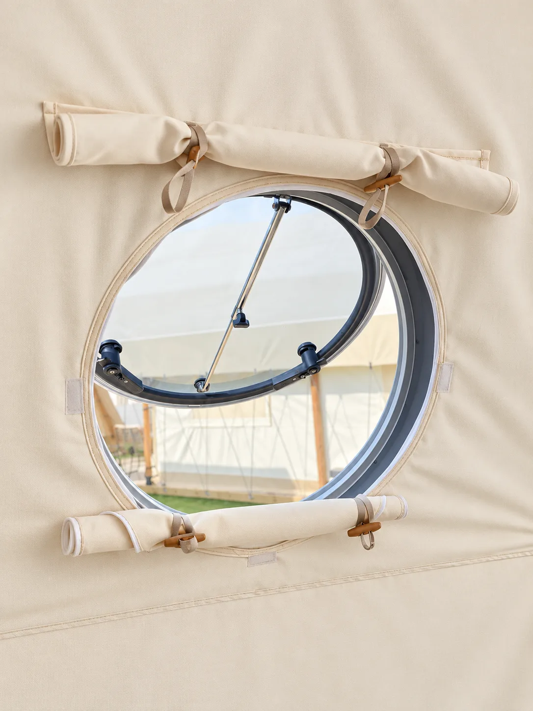 Opening porthole window on a geodesic dome